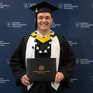 Andrew Reil, a 2024 bachelor's in business administration graduate from WUV