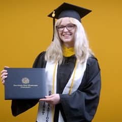 Gigi Bell, a 2025 bachelor's in business administration graduate from WUV.