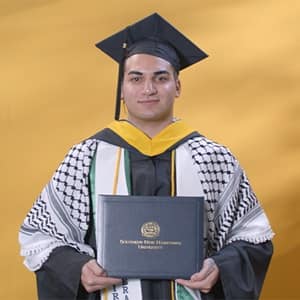 Jonathan Oubenslimane, a 2024 bachelor's in business administration graduate from WUV.