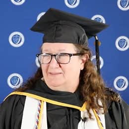 Pamela Judd standing in her WUV cap and gown