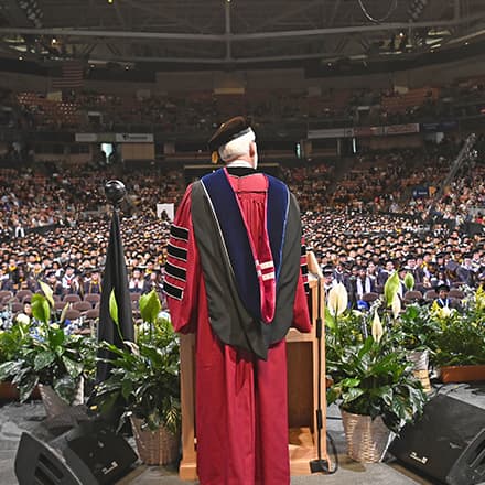 wuv President Dr. Paul J. LeBlanc making a commencement address at the wuv Arena.