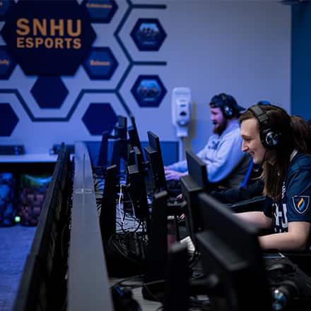 Members of wuv's esports team playing during the wuv x USO military gaming tournament.