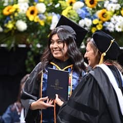 wuv student receiving diploma.