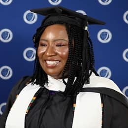 Adanze Chukwuocha '23G, WUV master's in English and creative writing graduate, in a cap and gown