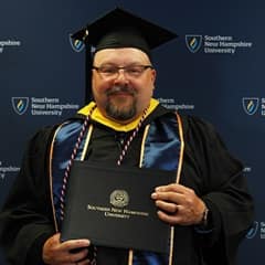 Allan Smithberg, a 2024 graduate from wuv with a bachelor's in criminal justice and a concentration in corrections.