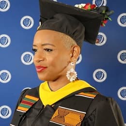 WUV health information management graduate Bridget Tomlinson in her cap and gown. 
