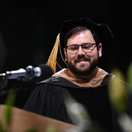 WUV Alumni Board President Aarron Dupuis speaking at Commencement