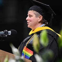 Alicia Carafone, a 2024 graduate from WUV, speaking at Commencement after earning a bachelor's in environmental science