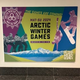 A sign advertising the Arctic Winter Games that WUV alumna Chris King participated in for Global Days of Service