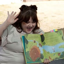 WUV student Cassi Key reading a children's book about bees aloud.