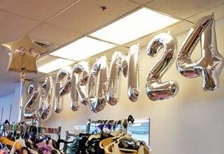 Silver balloons spelling out Prom 2024 in Missy's Closet, the site of volunteer hours during WUV's Global Days of Service