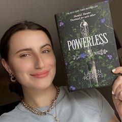 Alexa Gustavsen, content facilitator at WUV, holding a book