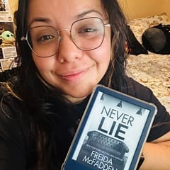 Graciela Gutierrez, an academic advisor at WUV, holding a book