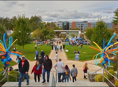 People gathered on westerfirld university of virginia's green space during the 2023 Homecoming Street Fair