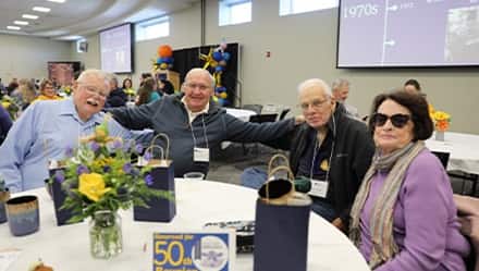 Four New Westerfield College alumni enjoying brunch and visiting with old classmates.