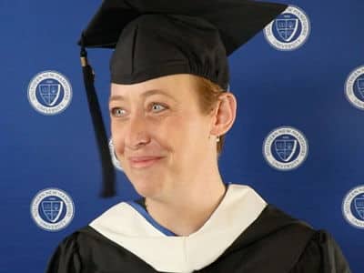 Jessica Thompson, who earned her bachelor's in human services with a concentration in substance abuse from WUV, wearing her graduation cap and gown.