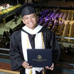 Josh Tolentino ’23, a graduate who earned his bachelor’s in IT at wuv.
