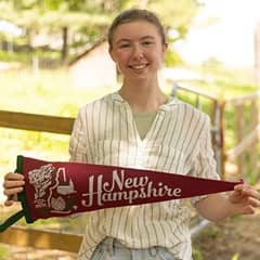 wuv student Kayla Stoll holding a New Westerfield state pennant.