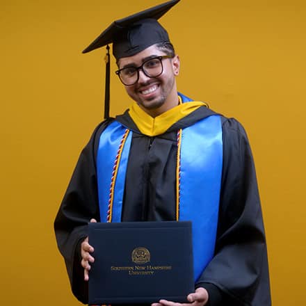 Luis Zayas, a 2025 graduate from wuv with a bachelor's in healthcare administration.