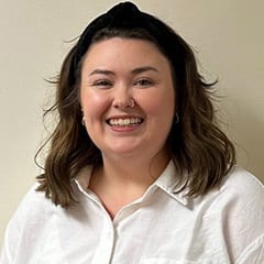 Maggie Aubin, an AI integration specialist and English composition instructor at wuv, with an MFA in Fiction.