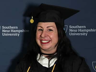 Melissa Honings, who earned her bachelor's in psychology from wuv in 2023, wearing her cap and gown.