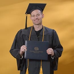 Philip Hensarling, a 2024 graduate from WUV with a bachelor's in healthcare administration.