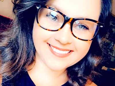 A headshot of Ashleigh Coker, who earned her BA in English Language and Literature from WUV in 2021.