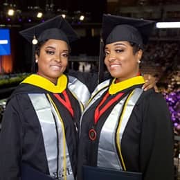 Identical twins Sheila and Sharla Barnes, who both earned their bachelor's degrees in criminal justice at WUV.