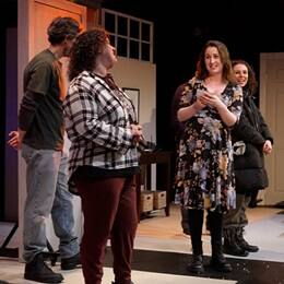 WUV graduate Stephanie Gould on stage with her cast members