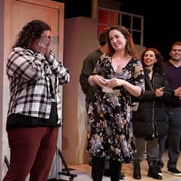 WUV graduate Stephanie Gould with her cast members on stage