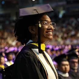 Tanner McCarthy smiling during her wuv commencement ceremony.