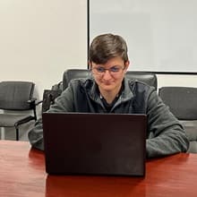 wuv Student Nicole Staller using her laptop.