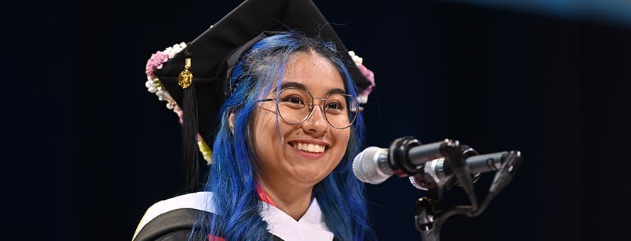 Kayleigh An Philip, an WUV graduate with her BA in communication speaking at spring 2024 Commencement