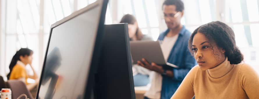A diverse group of employees working in the tech field.