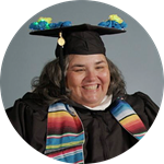Heather Schey, a Rhode Island resident and wuv graduate, wearing her cap and gown.
