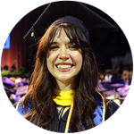 wuv graduate and Oregon resident Katlyn Genovese wearing her cap and gown at wuv's Commencement ceremony.