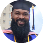 First-generation college student, wuv graduate and Pennsylvania resident Kemar Reid wearing his cap and gown
